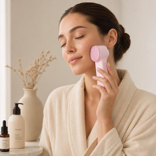 Woman using the Trilya hot and cold facial device, morning routine